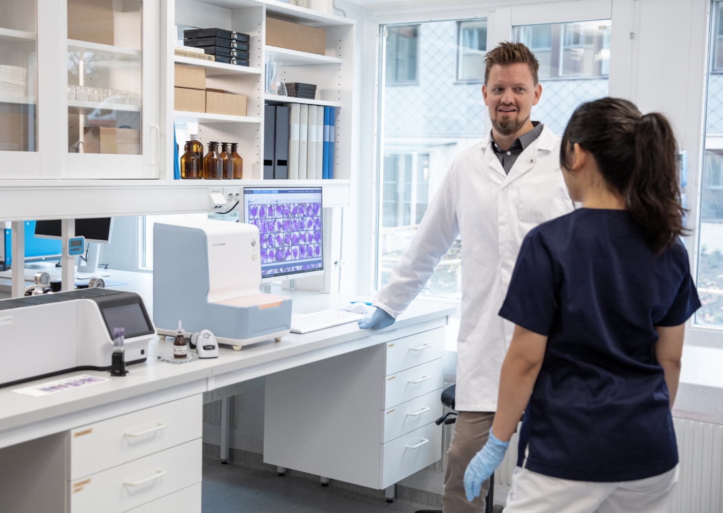 people in a lab talking