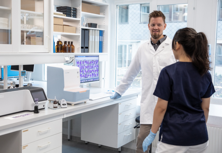 people in a lab talking